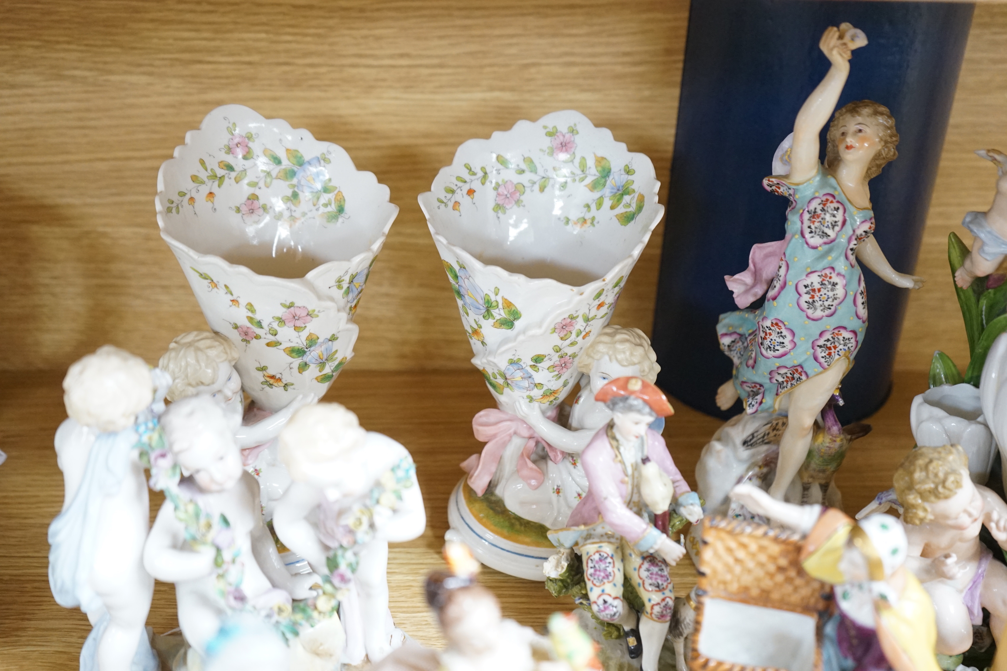 A group of continental porcelain figures, groups and ornaments